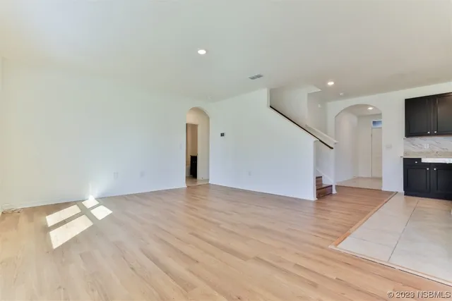 a view of a livingroom with an empty space and a fireplace