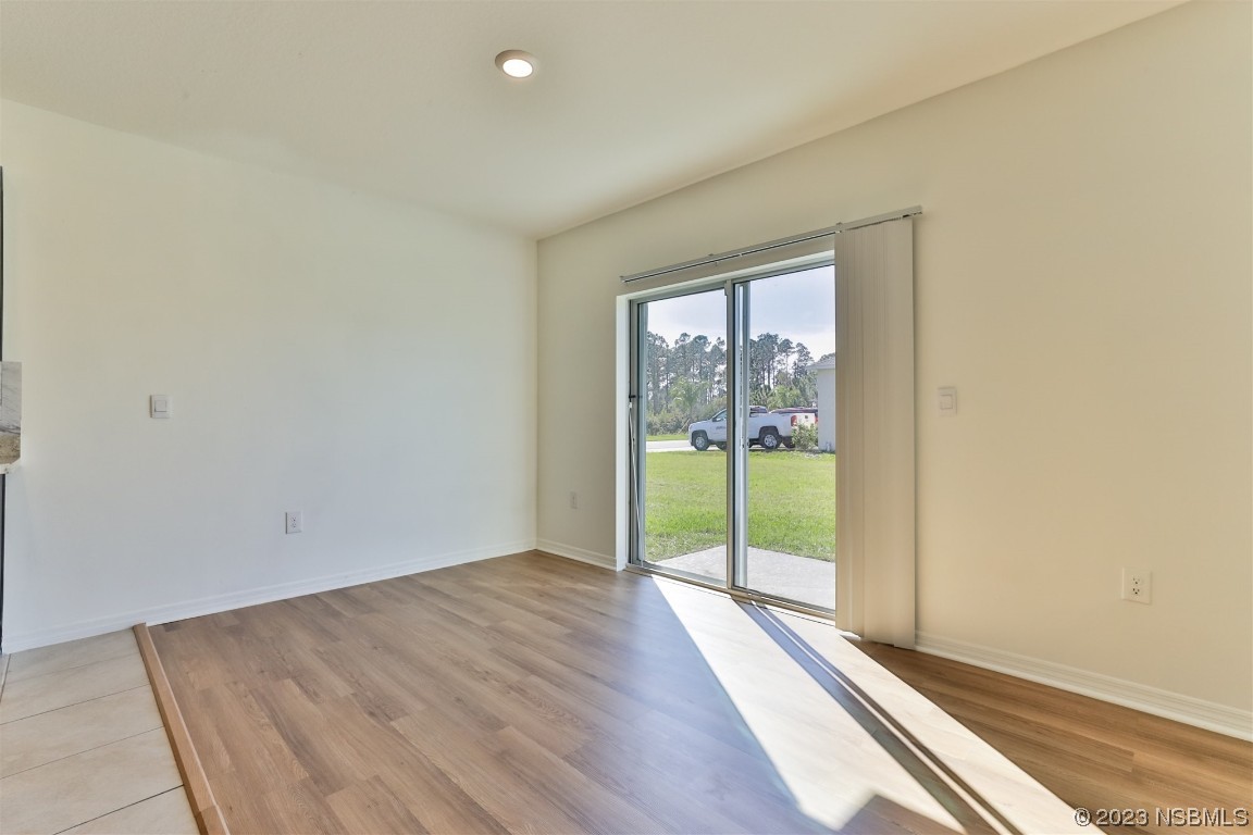 206 Old Mill Edgewater, FL 32141 - Photo 15 of 66 an empty room with wooden floor and windows