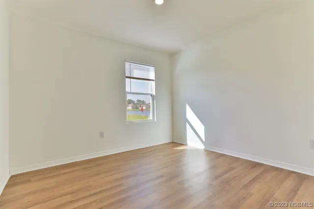 a view of a kitchen with a sink and a refrigerator