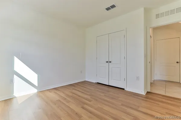 a view of hallway with wooden floor