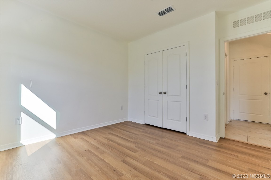 206 Old Mill Edgewater, FL 32141 - Photo 24 of 66 a view of an empty room with wooden floor