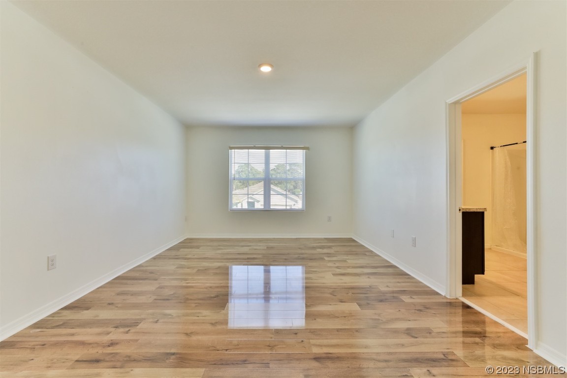 206 Old Mill Edgewater, FL 32141 - Photo 30 of 66 wooden floor in an empty room with a window