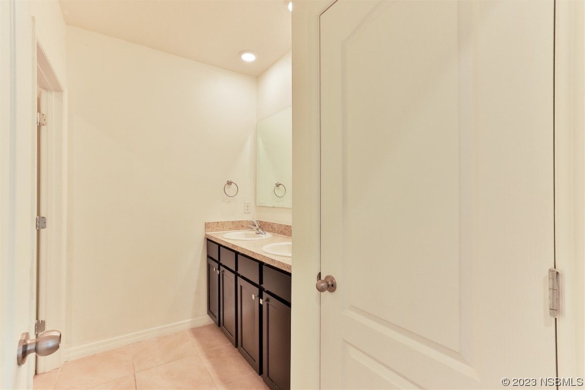 206 Old Mill Edgewater, FL 32141 - Photo 41 of 66 a bathroom with a granite countertop sink and a mirror