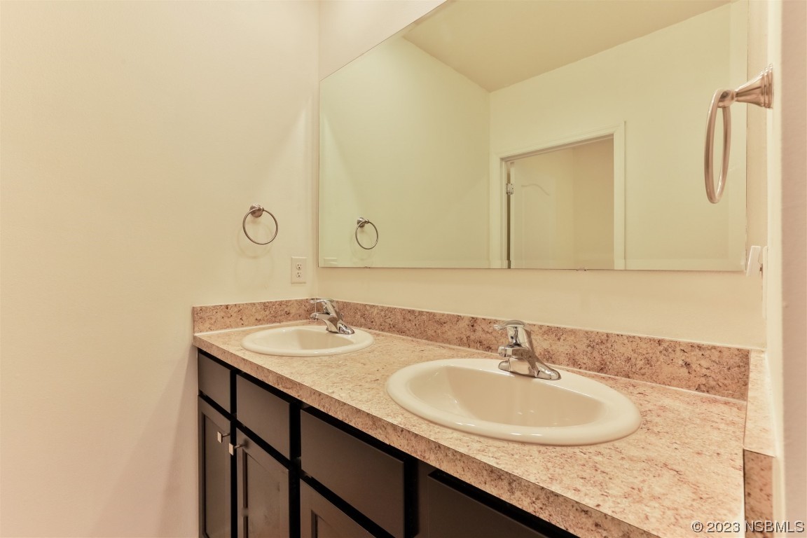 206 Old Mill Edgewater, FL 32141 - Photo 42 of 66 a bathroom with a sink and a mirror