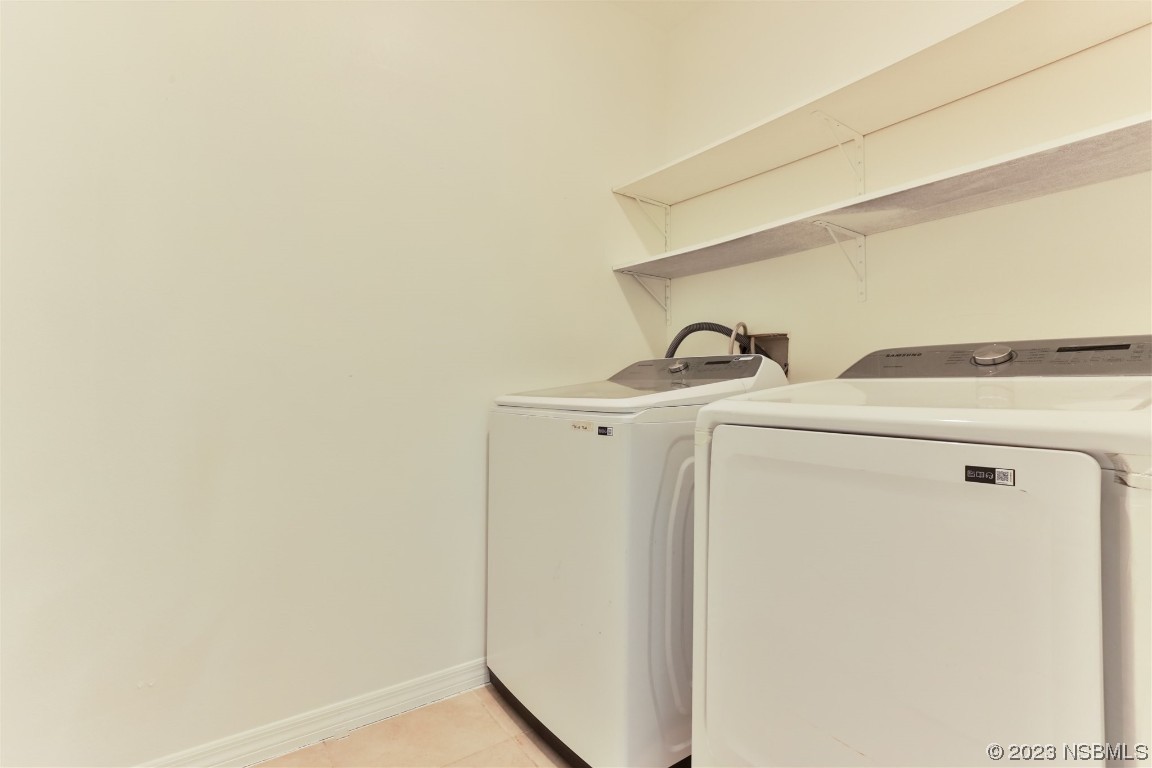 206 Old Mill Edgewater, FL 32141 - Photo 46 of 66 a utility room with dryer and washer