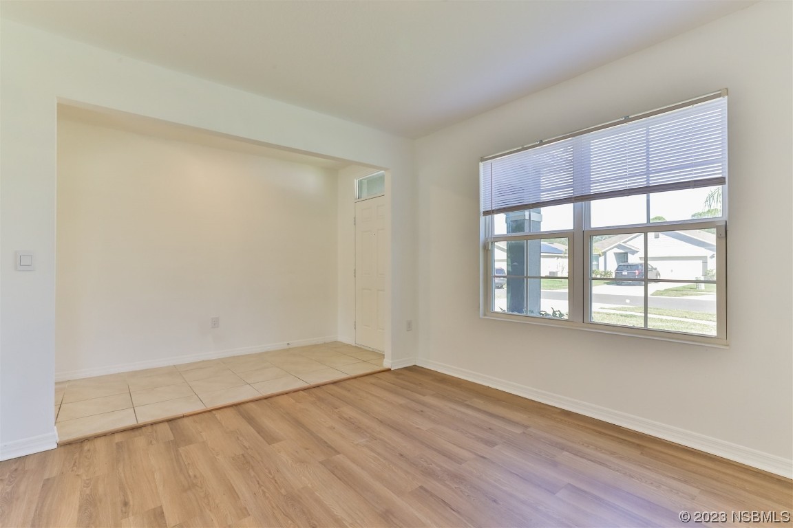 206 Old Mill Edgewater, FL 32141 - Photo 8 of 66 an empty room with wooden floor and windows