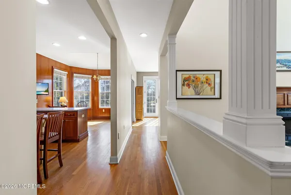 a living room with furniture a rug and a fireplace