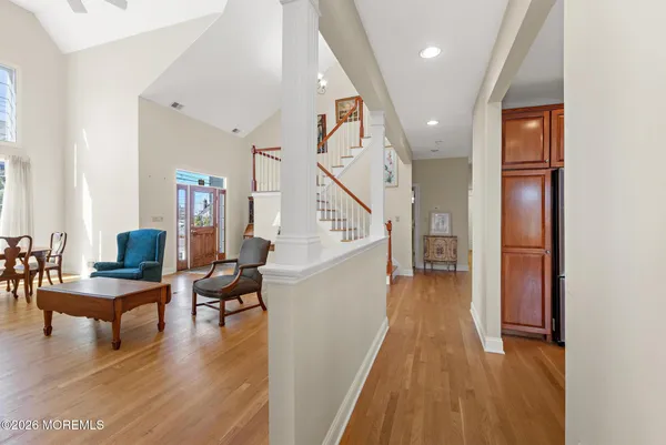 a living room with a large window and a glass door