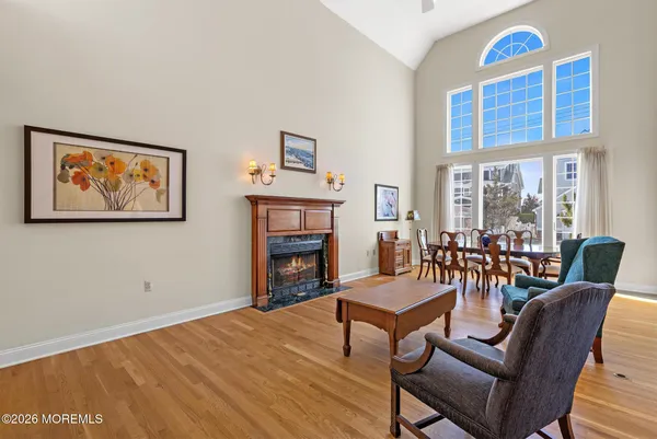 a living room with furniture and a chandelier