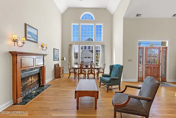a dining room with furniture and wooden floor