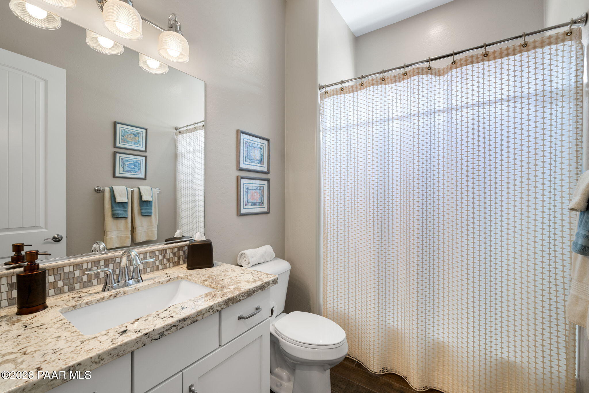 2792 Brooks Range Prescott, AZ 86301 - Photo 11 of 35 a bathroom with a granite countertop sink toilet and a mirror