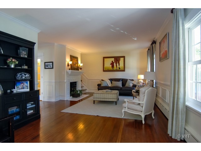 187 Ridge Avenue Winnetka, IL 60093 - Photo 2 of 18 a living room with furniture and a flat screen tv