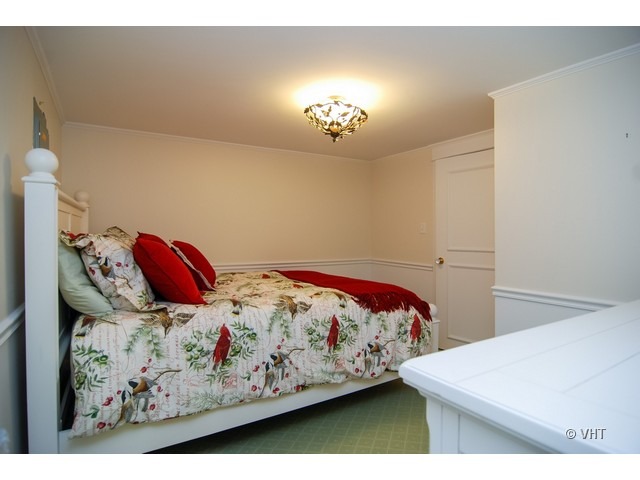 187 Ridge Avenue Winnetka, IL 60093 - Photo 11 of 18 a bedroom with a bed and a painting on the wall