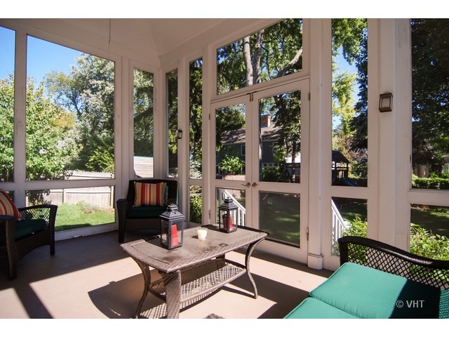 187 Ridge Avenue Winnetka, IL 60093 - Photo 13 of 18 a living room with patio furniture and a floor to ceiling window