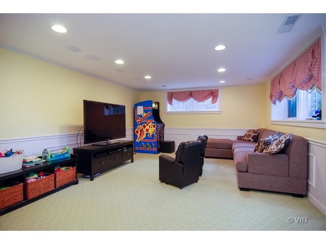 187 Ridge Avenue Winnetka, IL 60093 - Photo 6 of 18 a living room with furniture and a flat screen tv