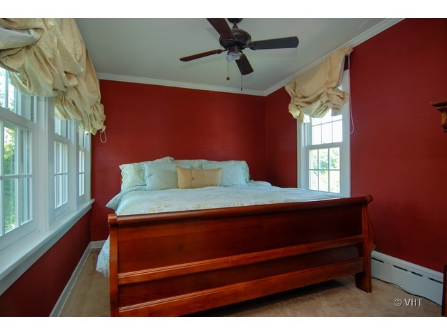 187 Ridge Avenue Winnetka, IL 60093 - Photo 7 of 18 a bedroom with a bed and a window