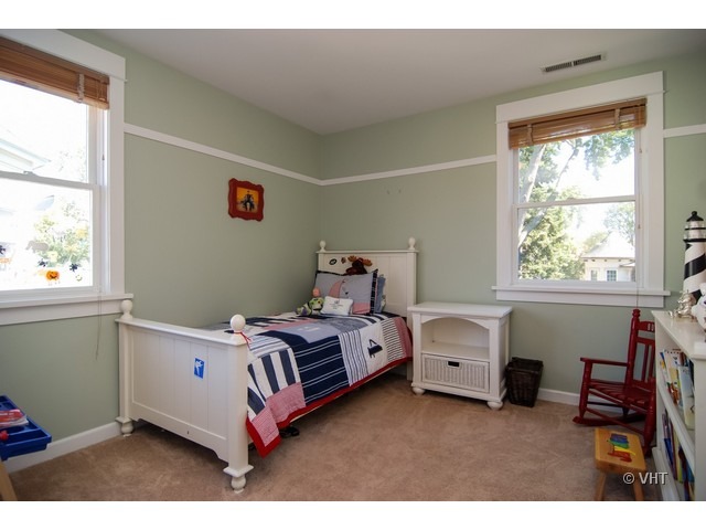 187 Ridge Avenue Winnetka, IL 60093 - Photo 10 of 18 a bedroom with a bed and a window