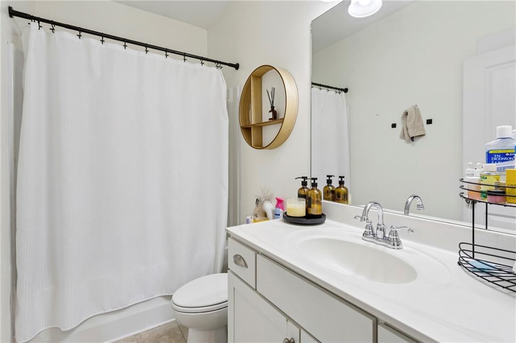 4006 Glendianne Way Powder Springs, GA 30127 - Photo 16 of 21 a bathroom with a sink and a mirror