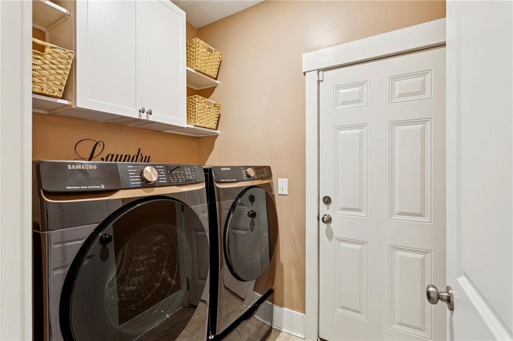 4006 Glendianne Way Powder Springs, GA 30127 - Photo 19 of 21 a utility room with dryer and washer