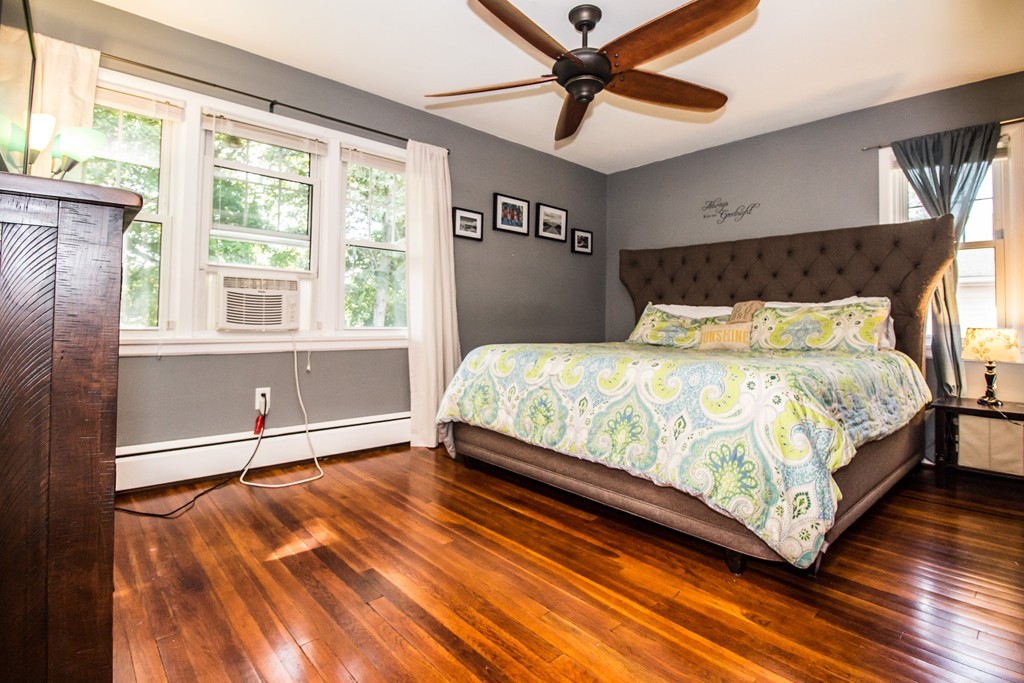 14 Governors Street Worcester, MA 01606 - Photo 17 of 26 a bedroom with a bed and wooden floor