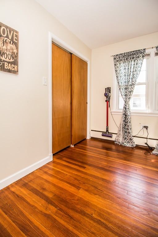 14 Governors Street Worcester, MA 01606 - Photo 19 of 26 a view of empty room with wooden floor and fan