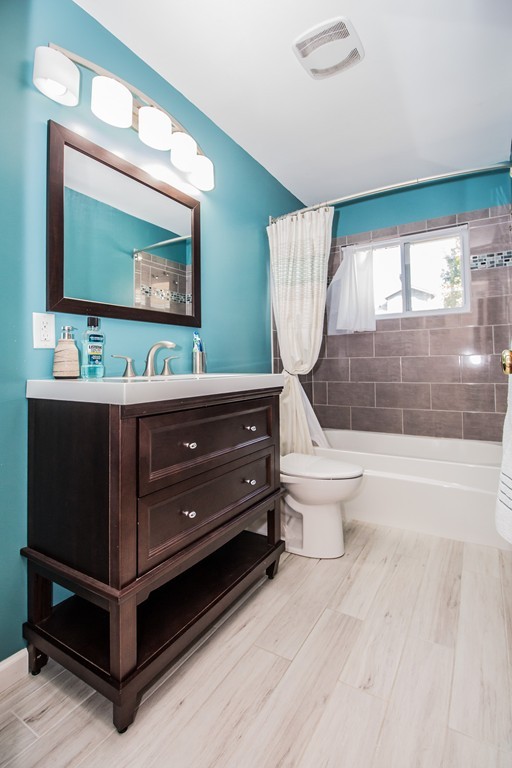 14 Governors Street Worcester, MA 01606 - Photo 20 of 26 a room with two flat screen tv and a floor to ceiling window