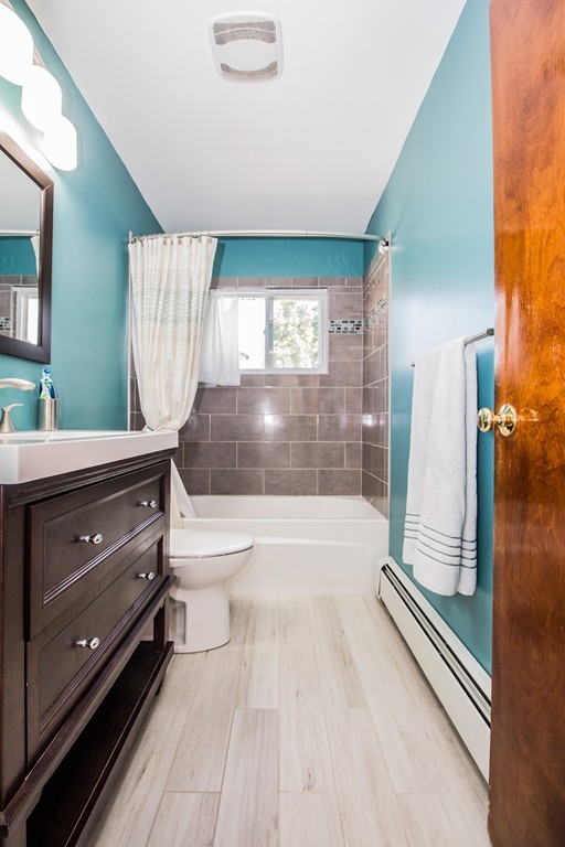 14 Governors Street Worcester, MA 01606 - Photo 21 of 26 a bathroom with a double vanity sink toilet and tub