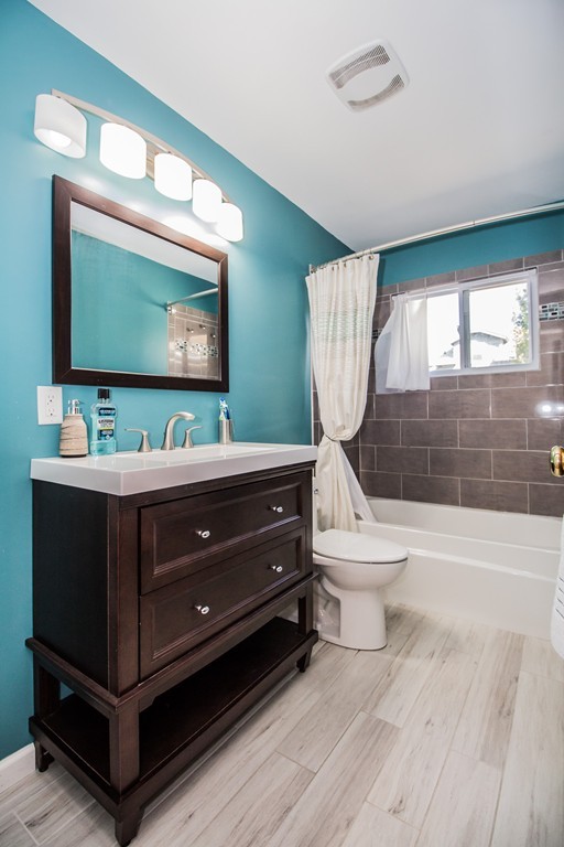 14 Governors Street Worcester, MA 01606 - Photo 22 of 26 a room with a bed and a flat screen tv