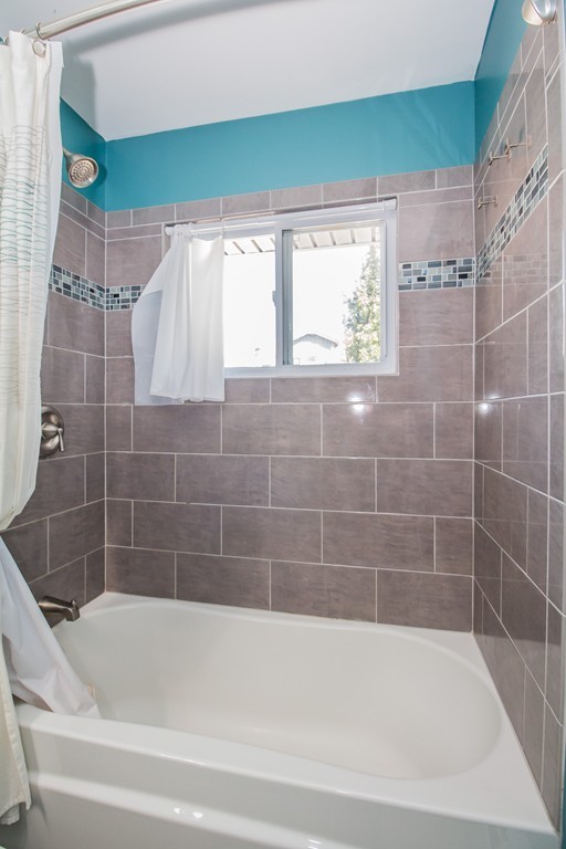 14 Governors Street Worcester, MA 01606 - Photo 23 of 26 a bathroom with a bathtub and a shower