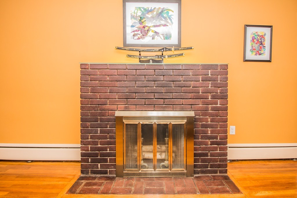 14 Governors Street Worcester, MA 01606 - Photo 6 of 26 a view of a fireplace with window