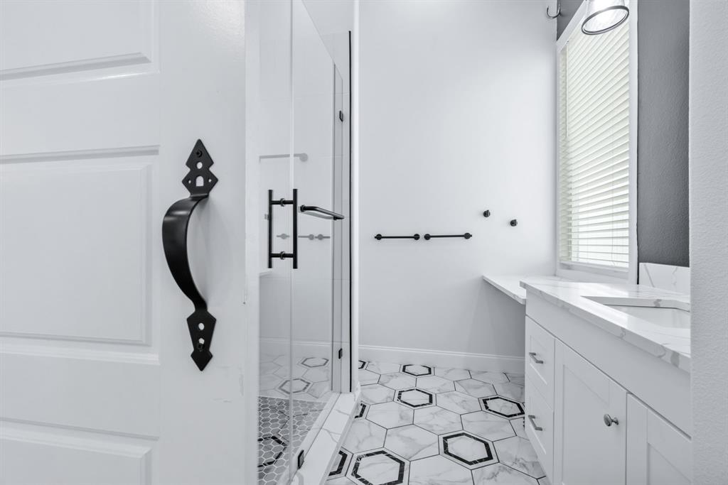 971 Sister Grove Road Van Alstyne, TX 75495 - Photo 25 of 38 a bathroom with a granite countertop sink a toilet and a mirror