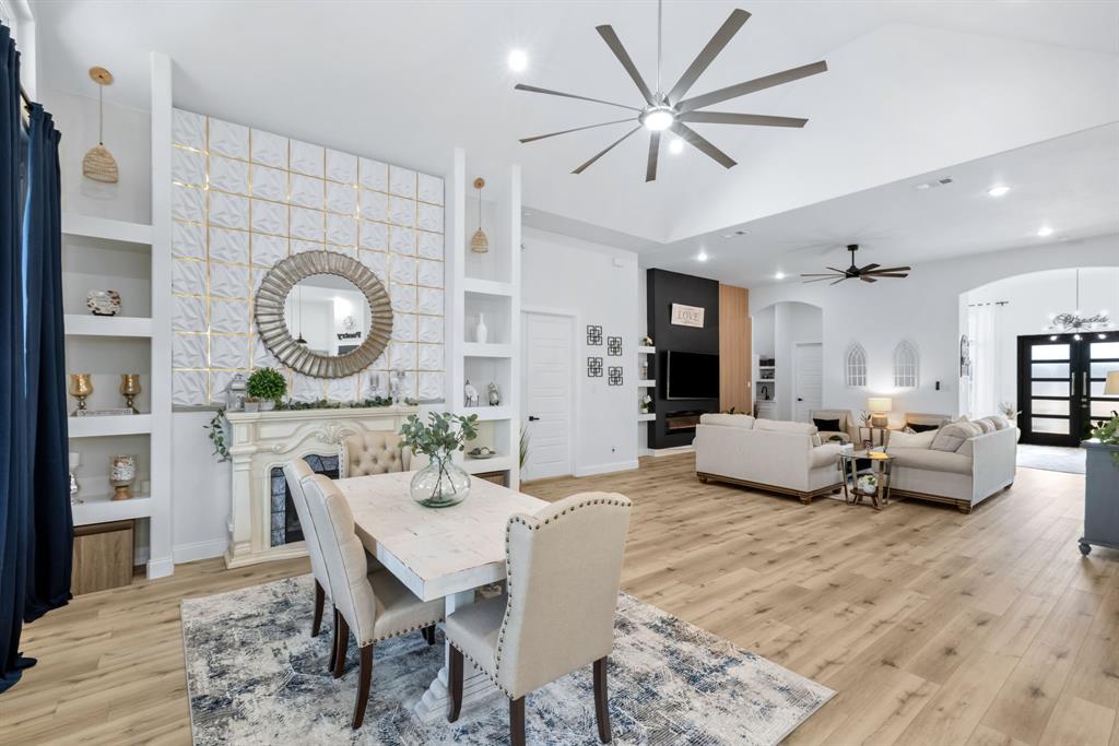 971 Sister Grove Road Van Alstyne, TX 75495 - Photo 3 of 38 a living room with furniture a clock and a mirror