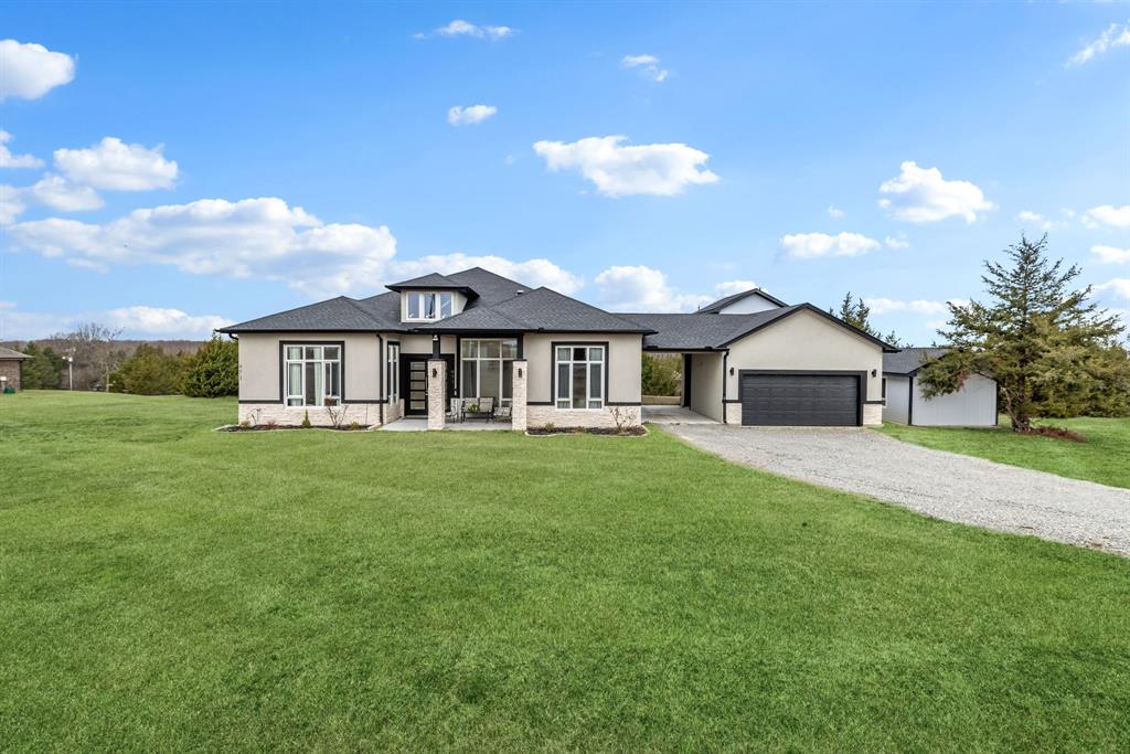 971 Sister Grove Road Van Alstyne, TX 75495 - Photo 34 of 38 a front view of a house with a garden