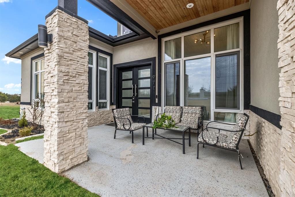 971 Sister Grove Road Van Alstyne, TX 75495 - Photo 5 of 38 a building outdoor space with patio furniture and potted plants