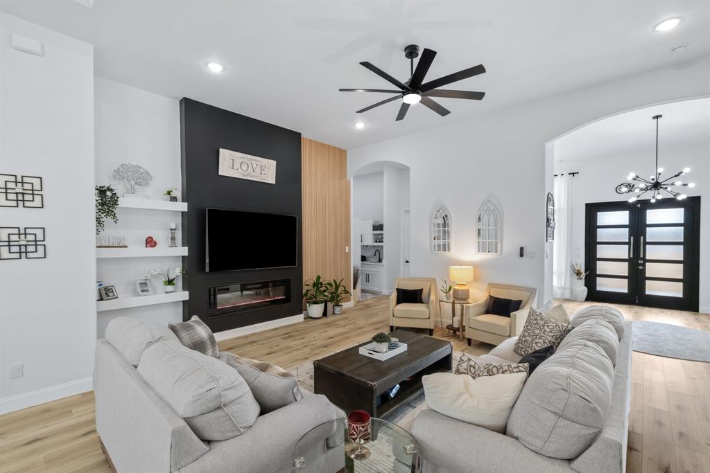 971 Sister Grove Road Van Alstyne, TX 75495 - Photo 6 of 38 a living room with furniture and a flat screen tv