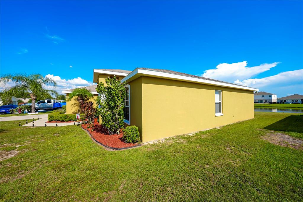 1070 Summer Glen Drive Winter Haven, FL 33880 - Photo 11 of 40 a view of a back yard of the house with a big yard