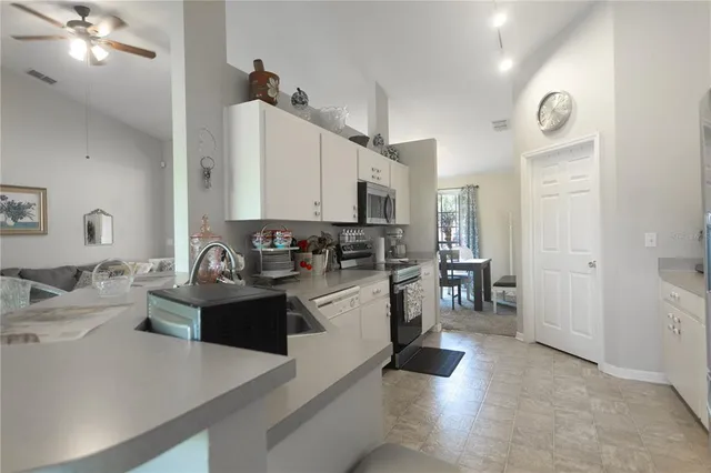 a view of a dining room with furniture and window