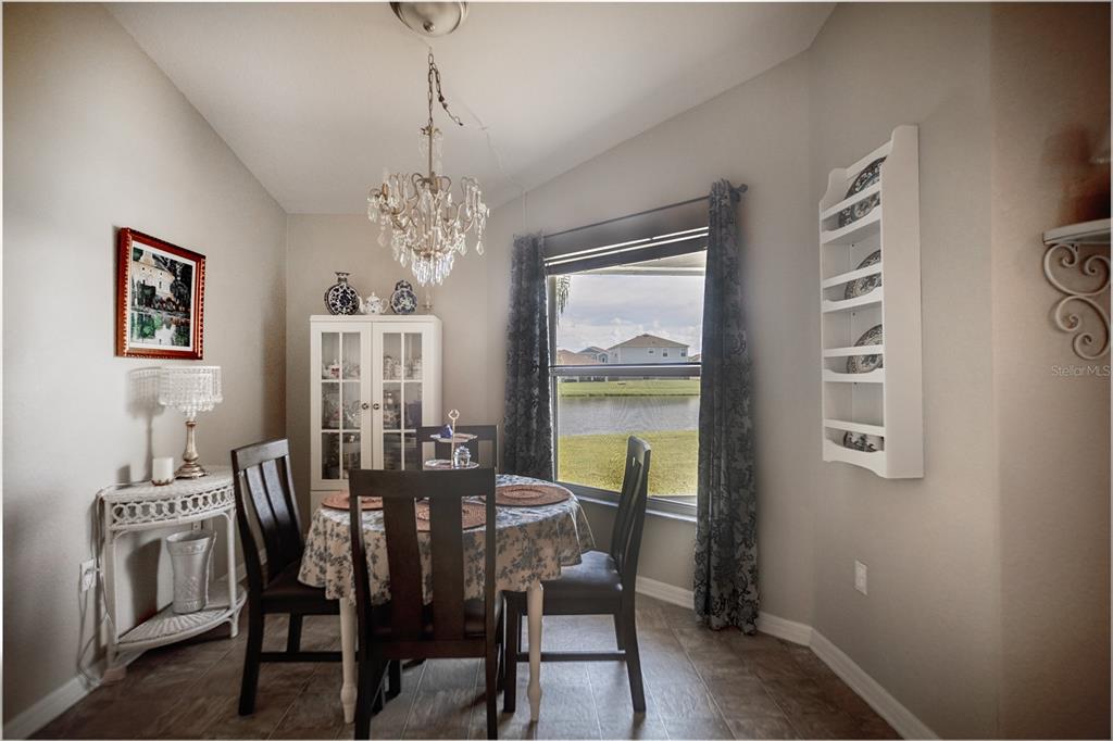 1070 Summer Glen Drive Winter Haven, FL 33880 - Photo 30 of 40 a view of a dining room with furniture and window
