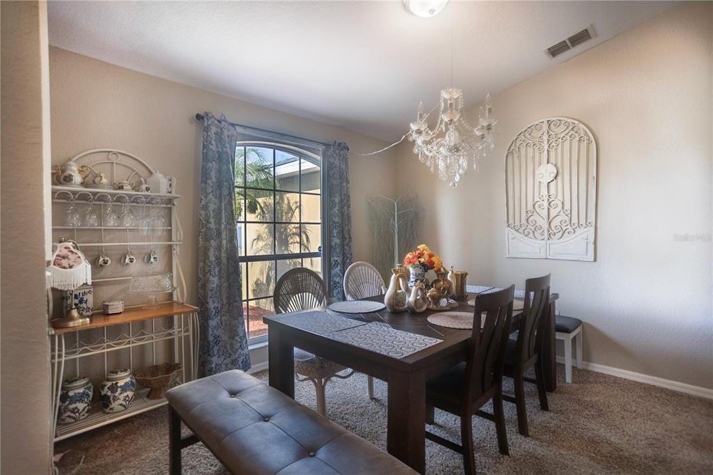 1070 Summer Glen Drive Winter Haven, FL 33880 - Photo 32 of 40 a view of a dining room with furniture window and outside view