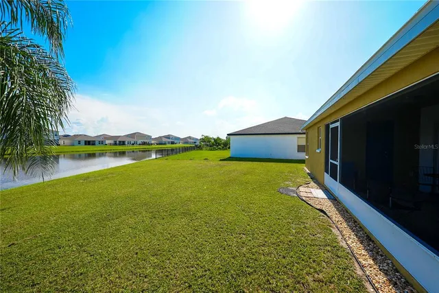 a view of a lake with a building in the background