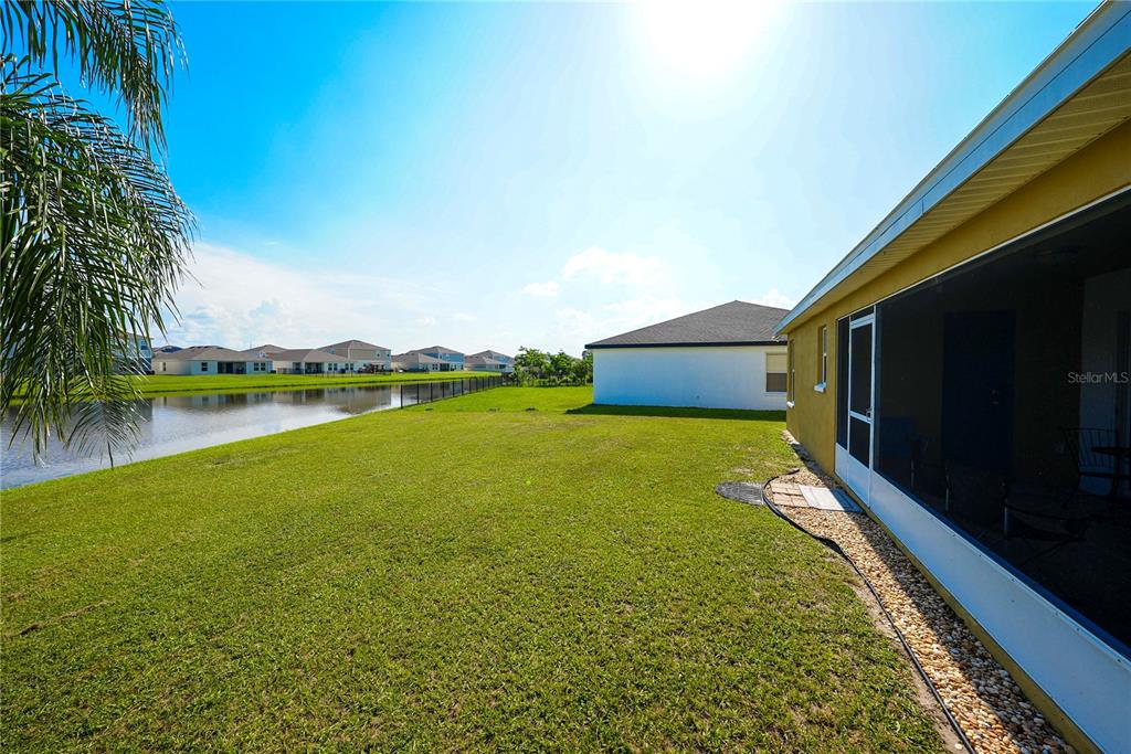 1070 Summer Glen Drive Winter Haven, FL 33880 - Photo 10 of 40 a view of a lake with a building in the background