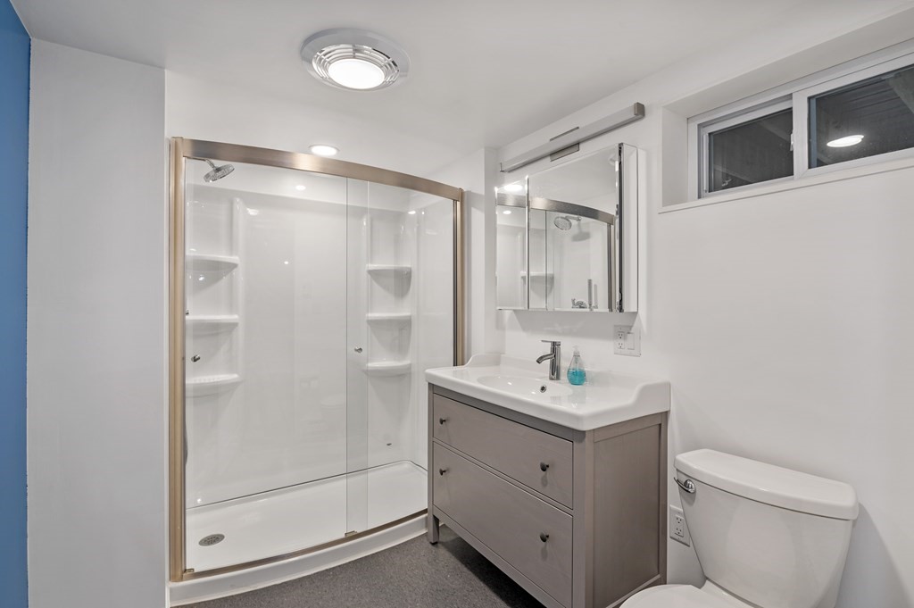 26 Temple Drive Methuen, MA 01844 - Photo 37 of 38 a bathroom with a sink toilet vanity and shower