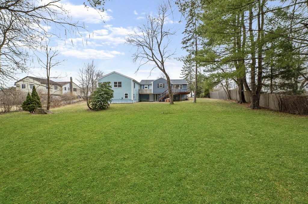 26 Temple Drive Methuen, MA 01844 - Photo 6 of 38 a view of a yard with a house and large trees