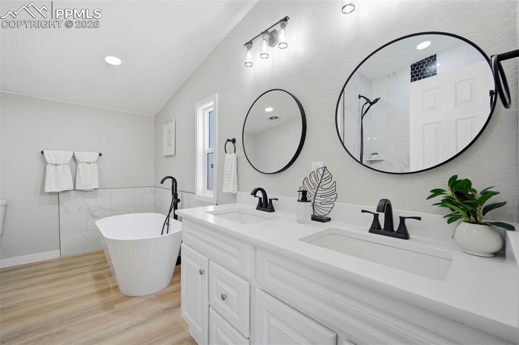 35125 Book Road Yoder, CO 80864 - Photo 13 of 45 a bathroom with a double vanity sink and a mirror