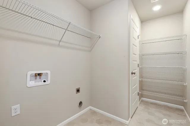 a view of storage and utility room with empty racks