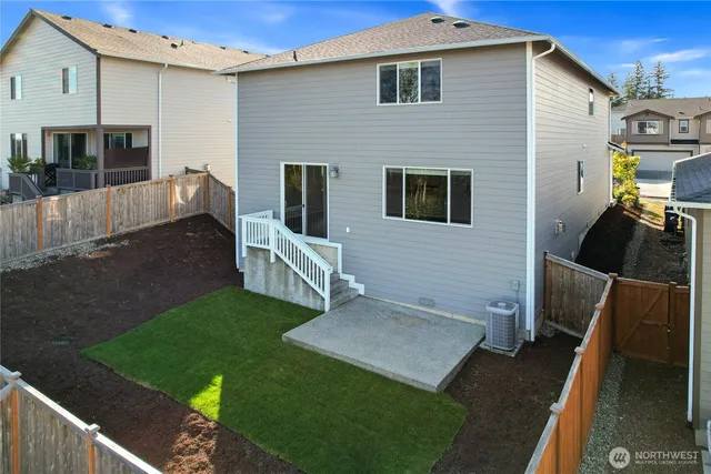 a view of house with backyard