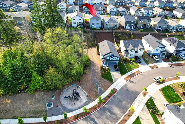 an aerial view of a house with outdoor space