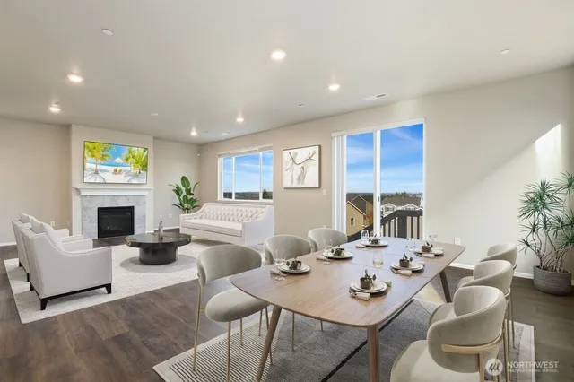 a living room with fireplace furniture and a table