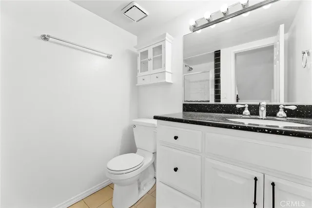 a bathroom with a glass shower door