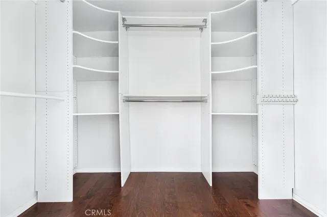 a bathroom with a granite countertop sink mirror vanity bathtub and a toilet